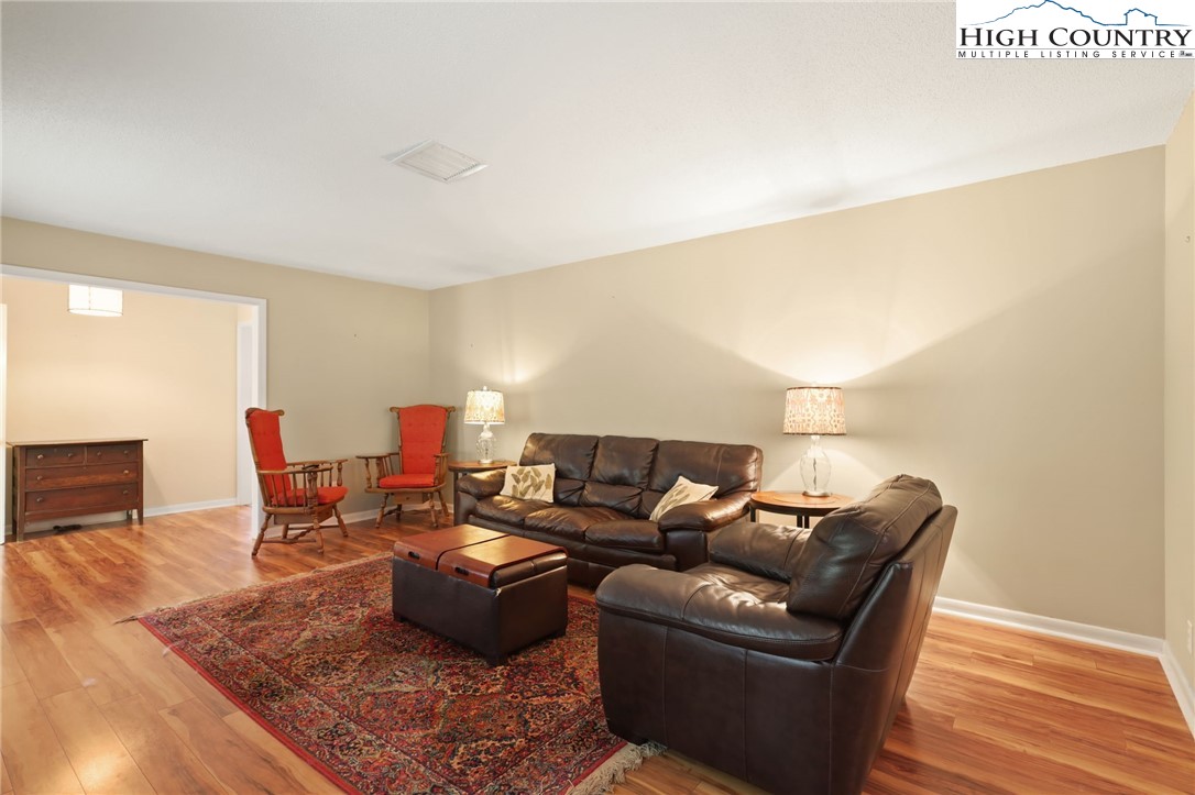 357 Kalmia Lane Boone, NC 28607 - Photo 7 of 41 a living room with furniture and a wooden floor