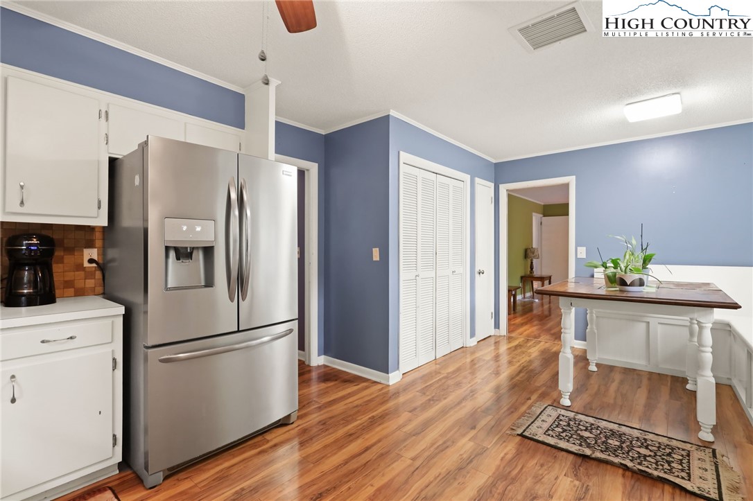357 Kalmia Lane Boone, NC 28607 - Photo 10 of 41 a kitchen with stainless steel appliances a refrigerator and a stove top oven