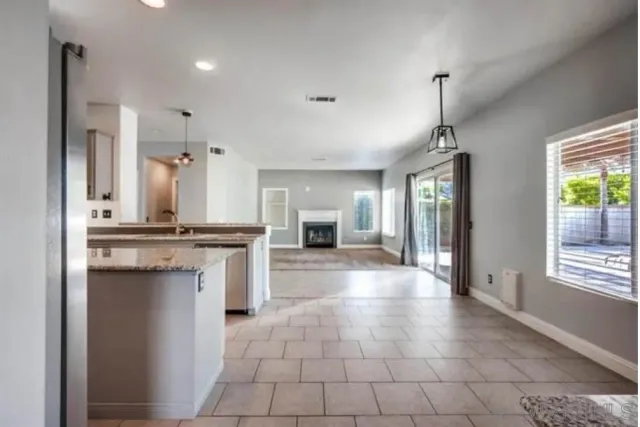 a view of a kitchen with a sink and a window