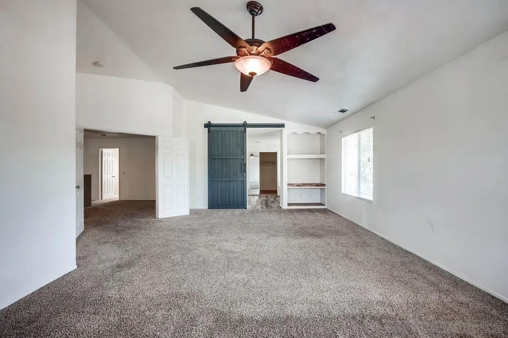 32789 Starlight Street Wildomar, CA 92595 - Photo 23 of 41 a view of a livingroom with a ceiling fan and window