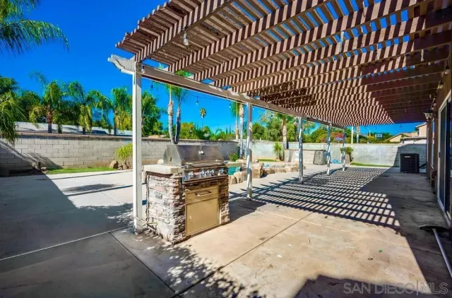 a view of a chairs and table in the patio