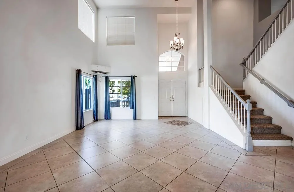 32789 Starlight Street Wildomar, CA 92595 - Photo 10 of 41 a view of an entryway with wooden floor and windows