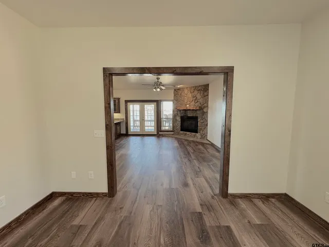 a view of kitchen with cabinets and wooden floor
