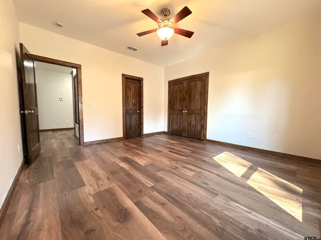 a view of kitchen and kitchen with granite countertop window