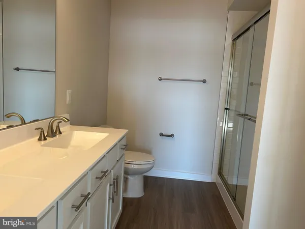 a bathroom with a sink toilet and vanity