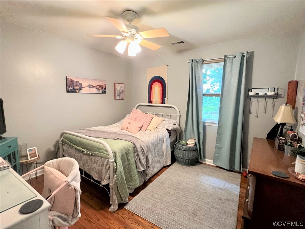 4520 Cralles Road Amelia Court House, VA 23002 - Photo 12 of 21 a bedroom with a bed and a chandelier