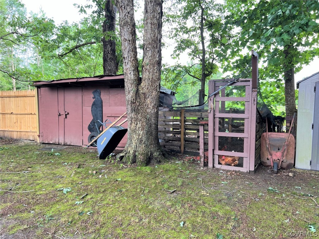 4520 Cralles Road Amelia Court House, VA 23002 - Photo 20 of 21 a view of a backyard with wooden fence and a large tree