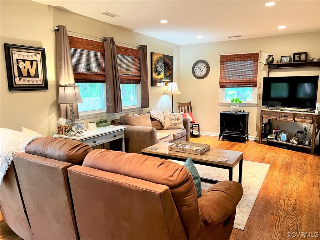 4520 Cralles Road Amelia Court House, VA 23002 - Photo 7 of 21 a living room with furniture a flat screen tv and a large window