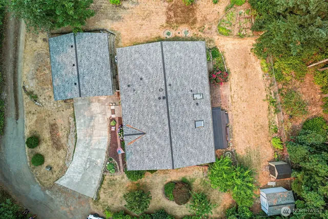 a view of a backyard with sitting area