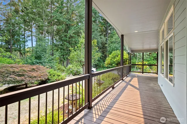 a front view of a house with a yard and potted plants