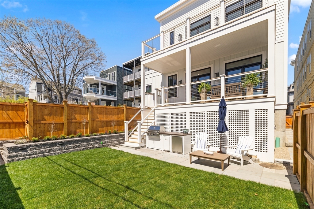 847 East 5th Street, Unit 2 Boston, MA 02127 - Photo 23 of 24 front view of a house with a yard