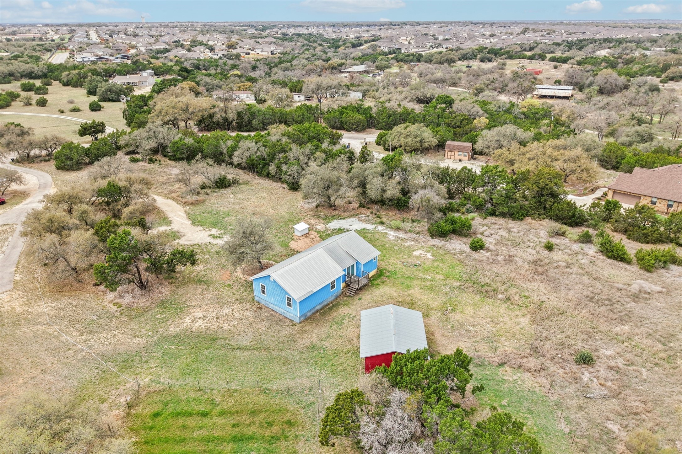 1470 Oak Grove Road Leander, TX 78641 - Photo 35 of 38 an aerial view of a house with a yard