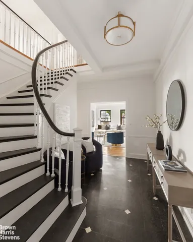 a view of a livingroom with furniture and hardwood floor