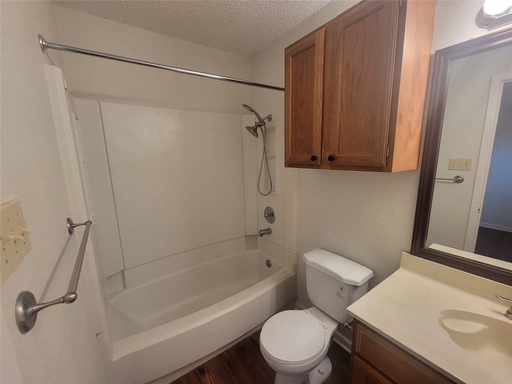 7825 Beauregard Circle, Unit 2A Austin, TX 78745 - Photo 26 of 27 a white toilet sitting next to a bath tub