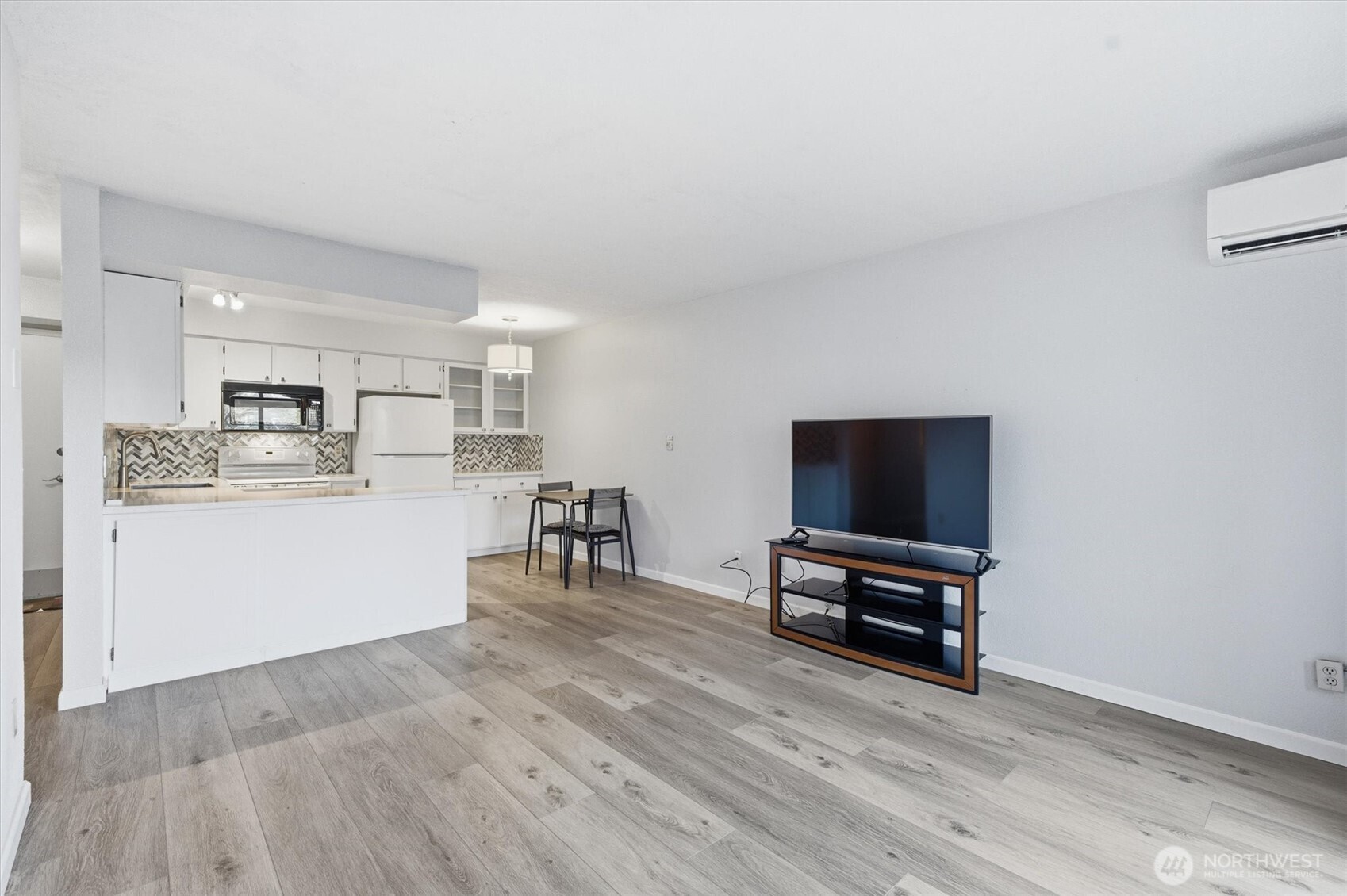 2005 Tibbetts Drive, Unit 209 Longview, WA 98632 - Photo 13 of 40 a living room with stainless steel appliances furniture and a flat screen tv