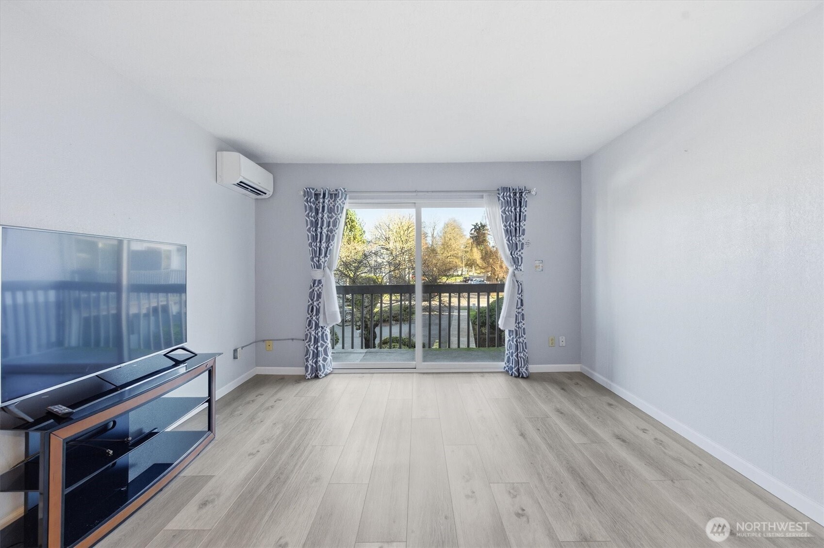 2005 Tibbetts Drive, Unit 209 Longview, WA 98632 - Photo 15 of 40 wooden floor in an empty room with a window