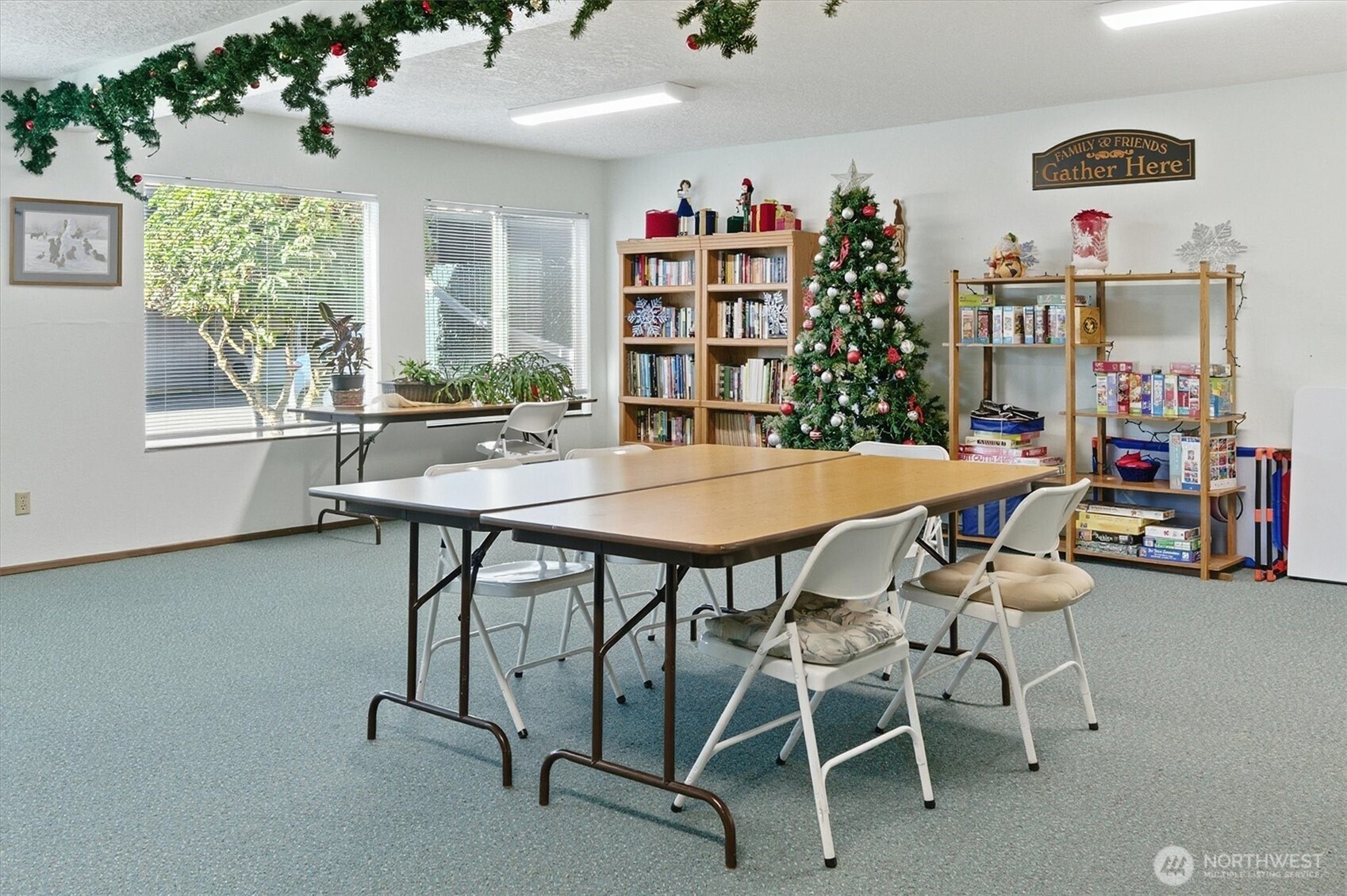 2005 Tibbetts Drive, Unit 209 Longview, WA 98632 - Photo 6 of 40 a view of a dining room with furniture and a book shelf