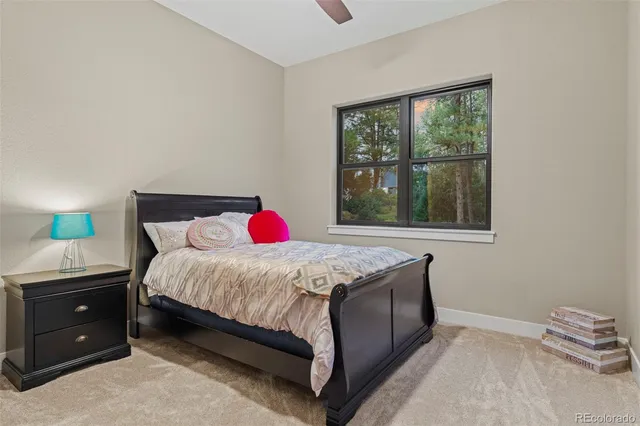 a bathroom with a double vanity sink a large mirror and shower