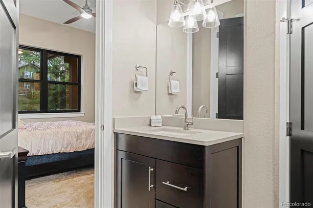 a bedroom with a bed and a view of bedroom