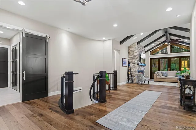 a view of a livingroom with furniture and staircase