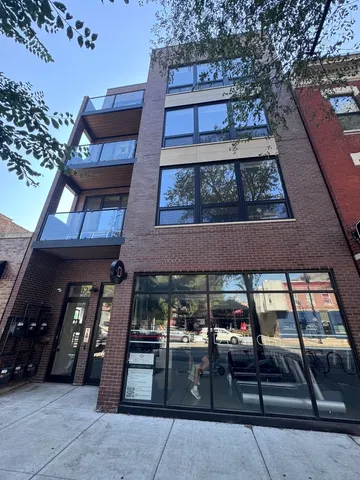 a view of a building with sitting area
