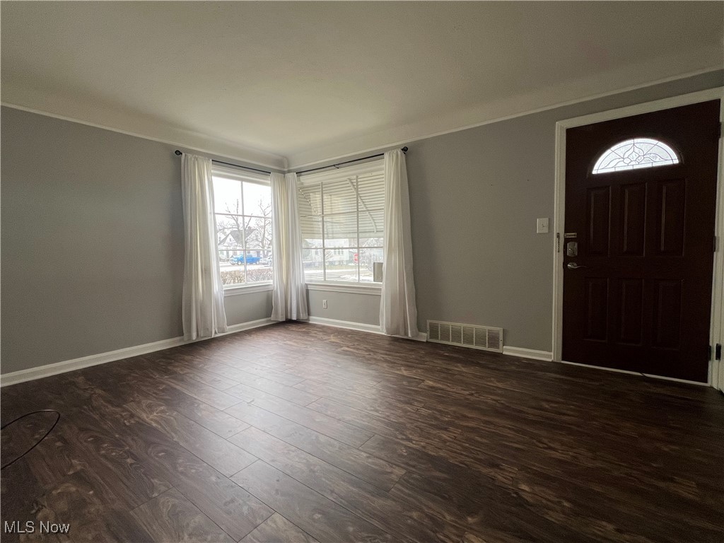 20611 Franklin Road Maple Heights, OH 44137 - Photo 6 of 31 Foyer featuring dark hardwood / wood-style flooring and crown molding