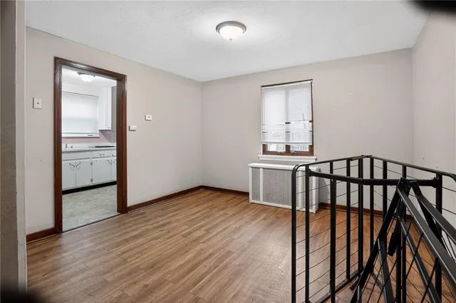 wooden floor with a bathroom