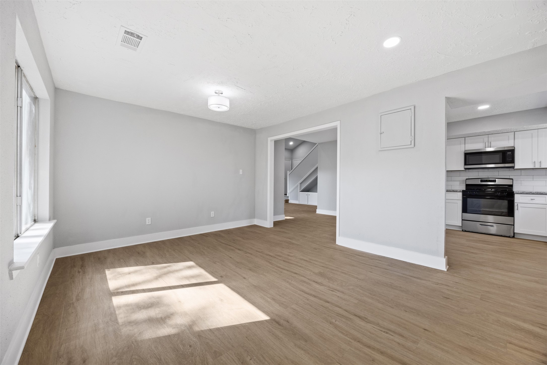 3030 Becket Street Pearland, TX 77584 - Photo 13 of 22 a view of empty room with wooden floor