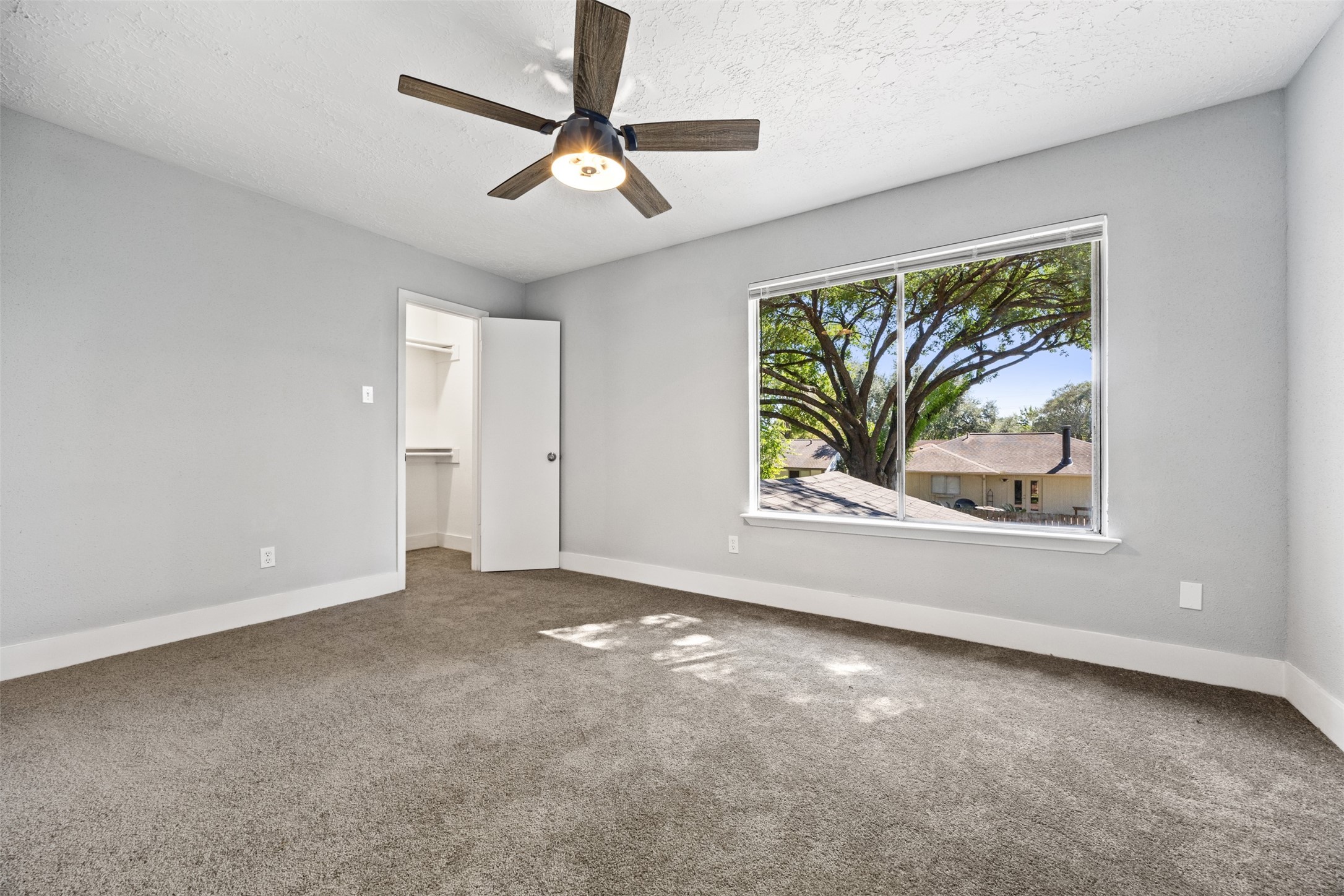 3030 Becket Street Pearland, TX 77584 - Photo 14 of 22 an empty room with windows and fan