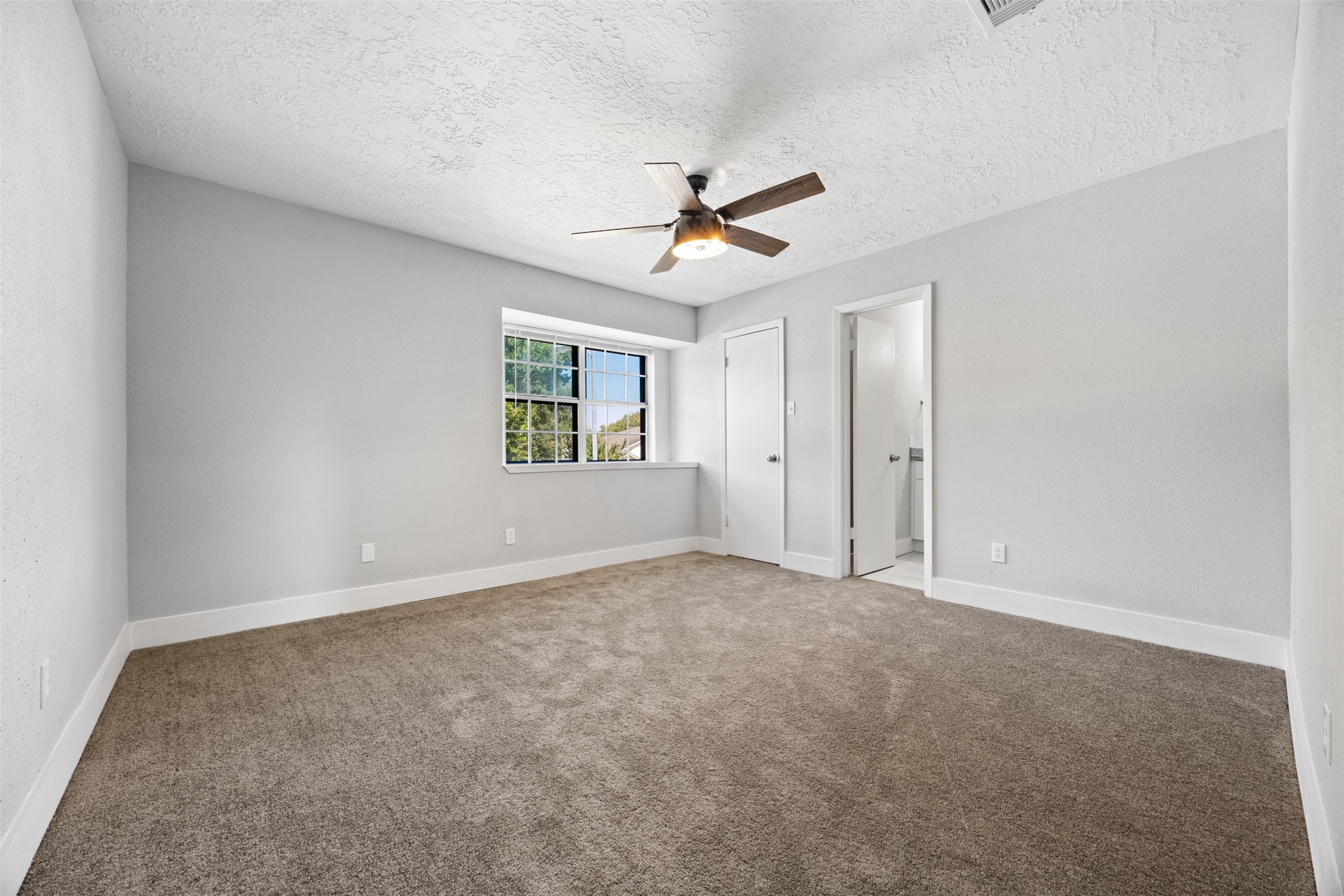 3030 Becket Street Pearland, TX 77584 - Photo 18 of 22 a view of an empty room with a window