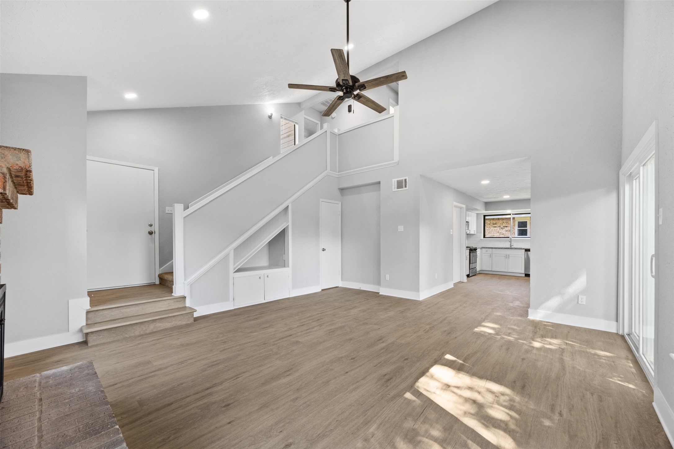 3030 Becket Street Pearland, TX 77584 - Photo 8 of 22 a view of empty room with stairs and wooden floor