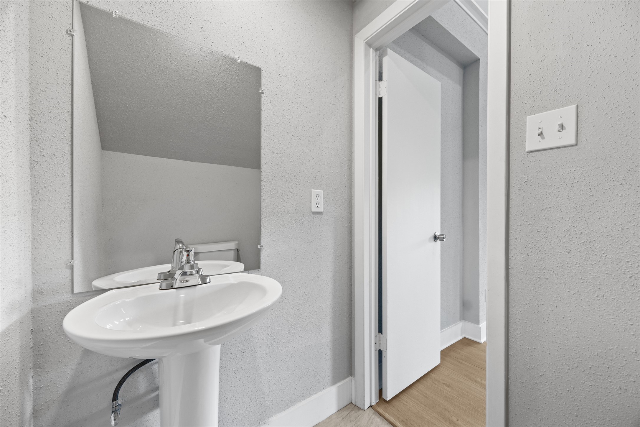 3030 Becket Street Pearland, TX 77584 - Photo 9 of 22 a bathroom with a sink and a mirror