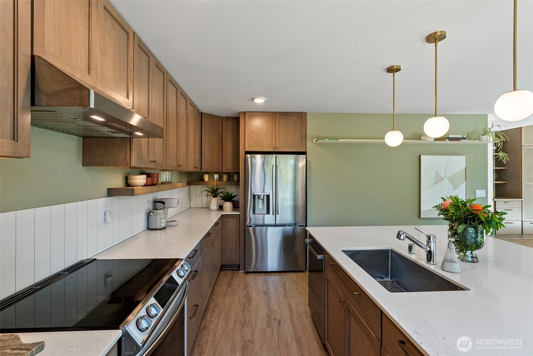 503 5th Street Steilacoom, WA 98388 - Photo 16 of 40 a kitchen with stainless steel appliances granite countertop a sink refrigerator and microwave