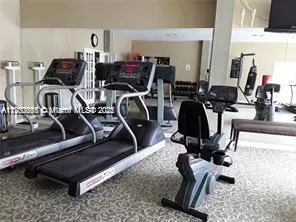 a view of a room with gym equipment