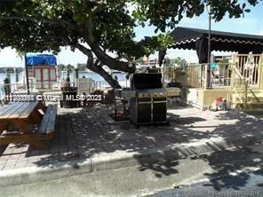 a roof deck with table and chairs