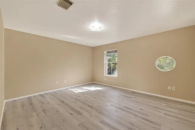 a bathroom with a double vanity sink toilet mirror and bathtub
