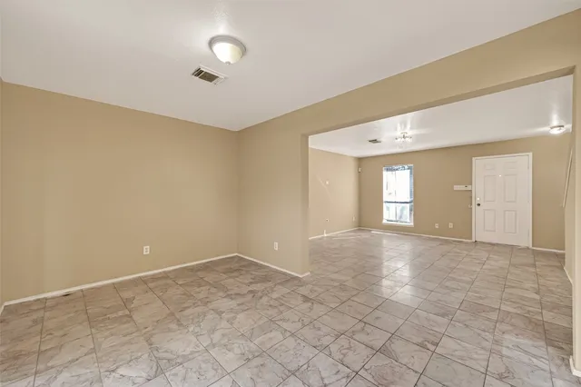 a view of an empty room and window