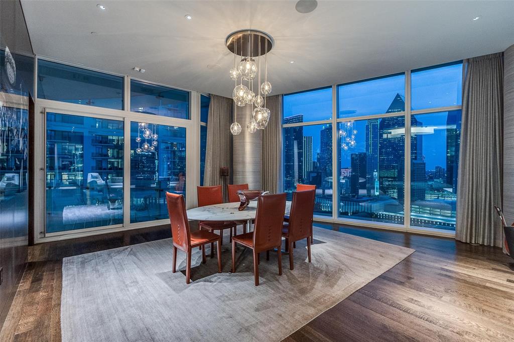 1918 Olive Street, Unit 1603 Dallas, TX 75201 - Photo 7 of 33 a dining room with furniture a chandelier and wooden floor