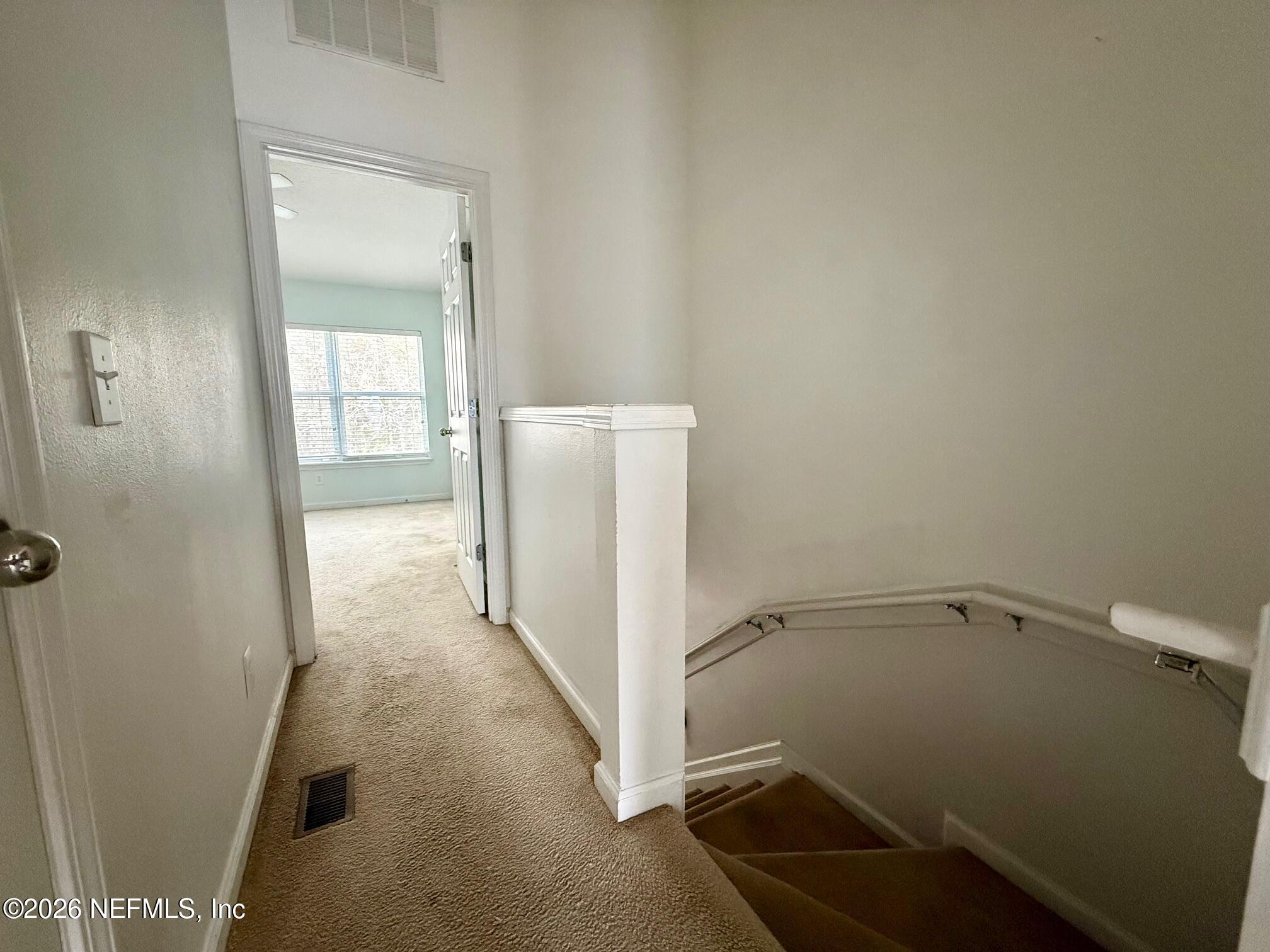 3585 Pebble Path Lane Jacksonville, FL 32224 - Photo 11 of 16 a view of a room with rack on the wall