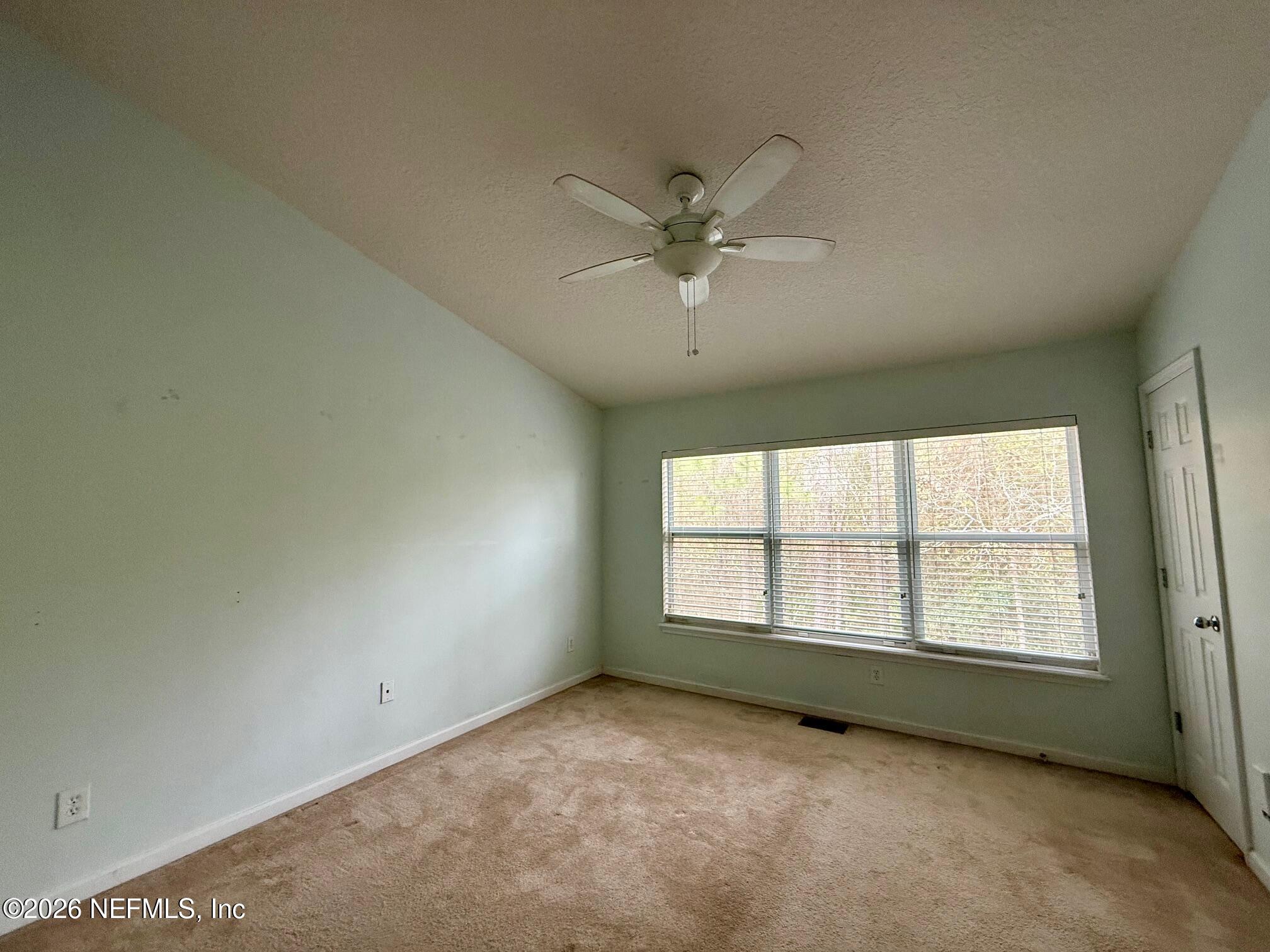 3585 Pebble Path Lane Jacksonville, FL 32224 - Photo 12 of 16 an empty room with a window