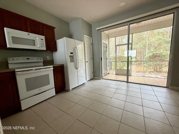 a view of a kitchen with an oven and cabinets