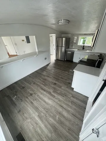 a view of a kitchen living room with furniture