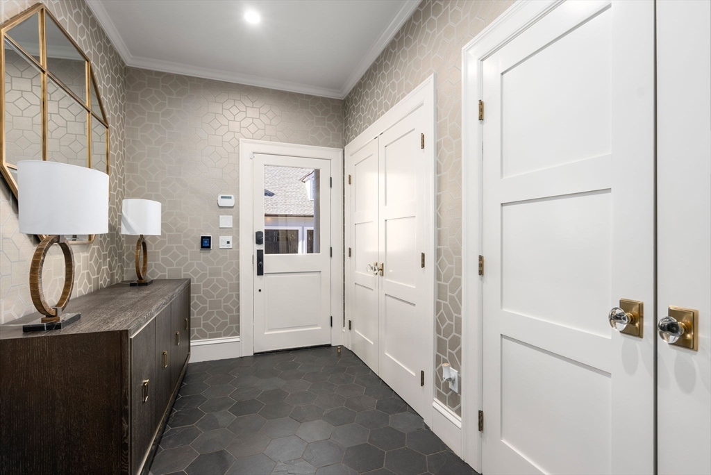 123 Abbott Road Wellesley, MA 02481 - Photo 16 of 42 a bathroom with a sink and mirror