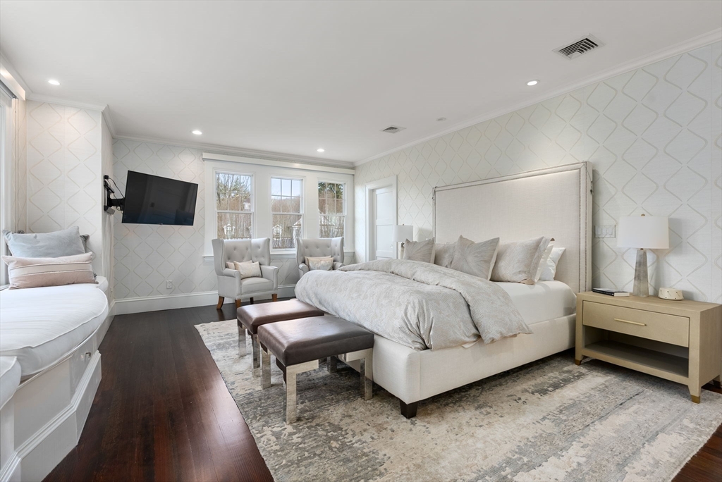 123 Abbott Road Wellesley, MA 02481 - Photo 19 of 42 a spacious bedroom with a bed and a flat screen television