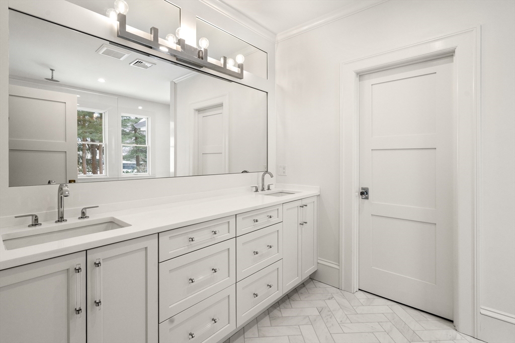 123 Abbott Road Wellesley, MA 02481 - Photo 20 of 42 a bathroom with double sink and a mirror