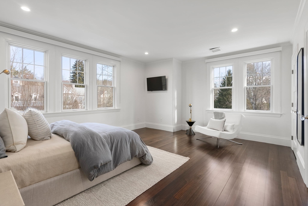 123 Abbott Road Wellesley, MA 02481 - Photo 22 of 42 a spacious bedroom with a bed and wooden floor