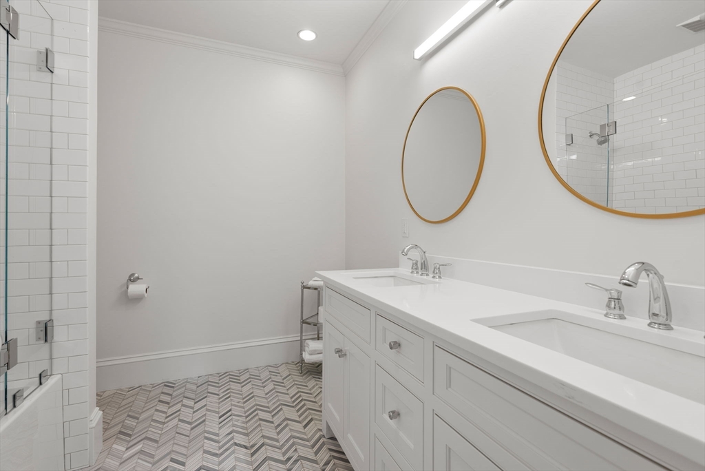 123 Abbott Road Wellesley, MA 02481 - Photo 23 of 42 a bathroom with a sink and a mirror