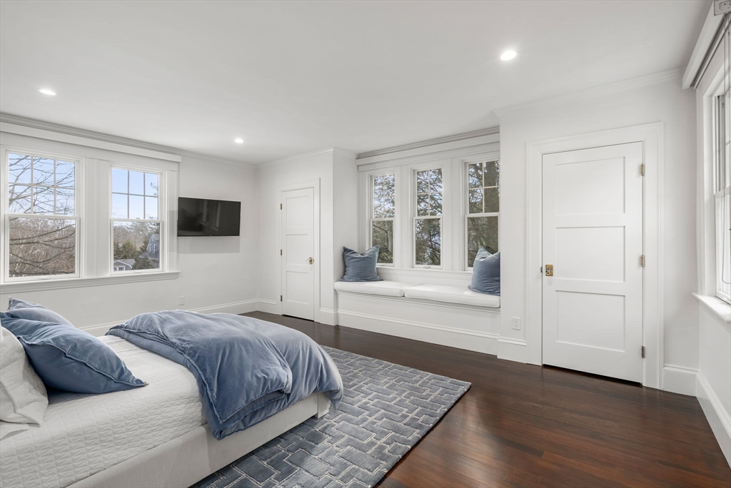 123 Abbott Road Wellesley, MA 02481 - Photo 24 of 42 a bedroom with a large bed and a couch