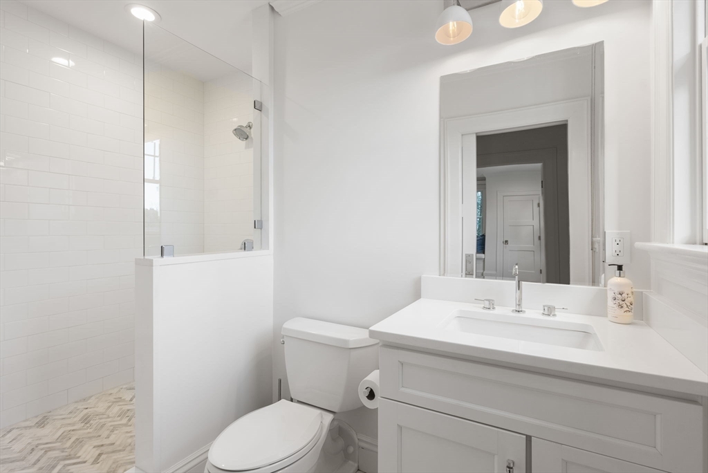 123 Abbott Road Wellesley, MA 02481 - Photo 25 of 42 a bathroom with a sink a toilet and shower