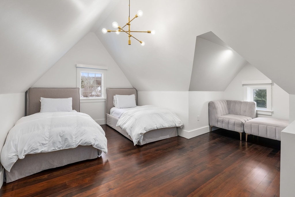 123 Abbott Road Wellesley, MA 02481 - Photo 31 of 42 a bedroom with a bed and wooden floor